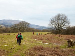 guests on hike brecon beacons wales new year retreat snowcapped mountains