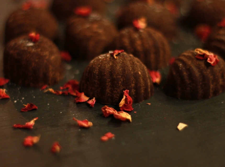 half moon shaped raw cacao chocolates with rose petals 