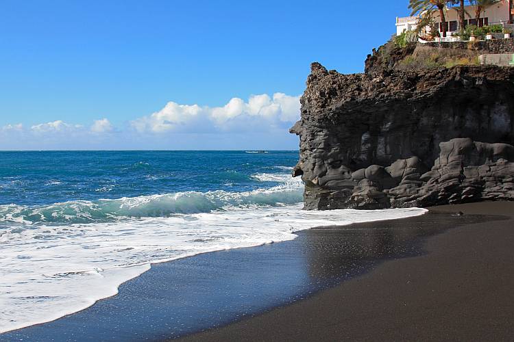 santorini black sand beach and cliff