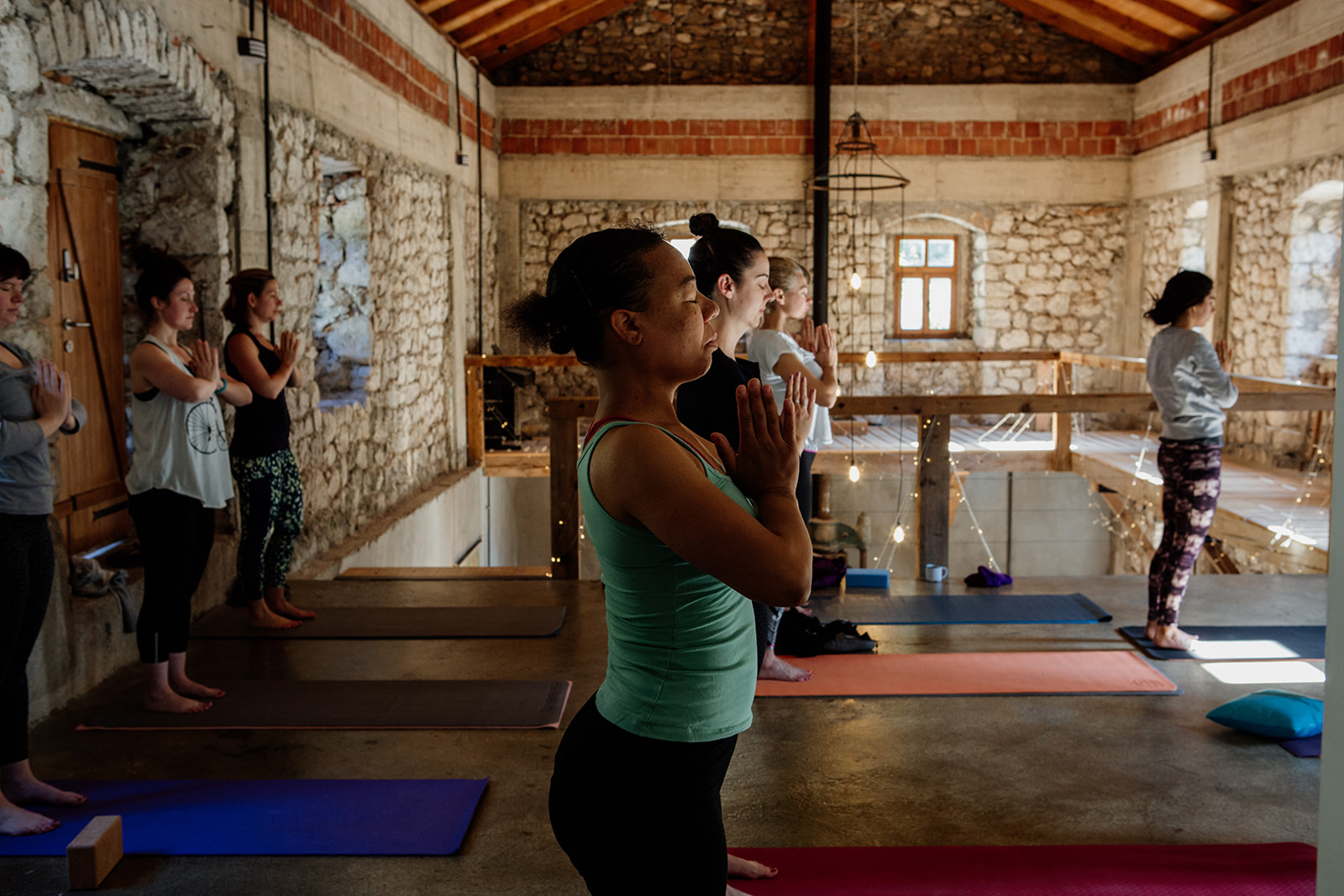 tadasana hands in prayer in yoga space - yoga holiday montenegro