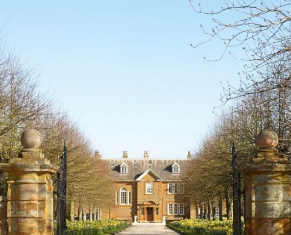 oxford venue in distance down wintery tree lined stone driveway