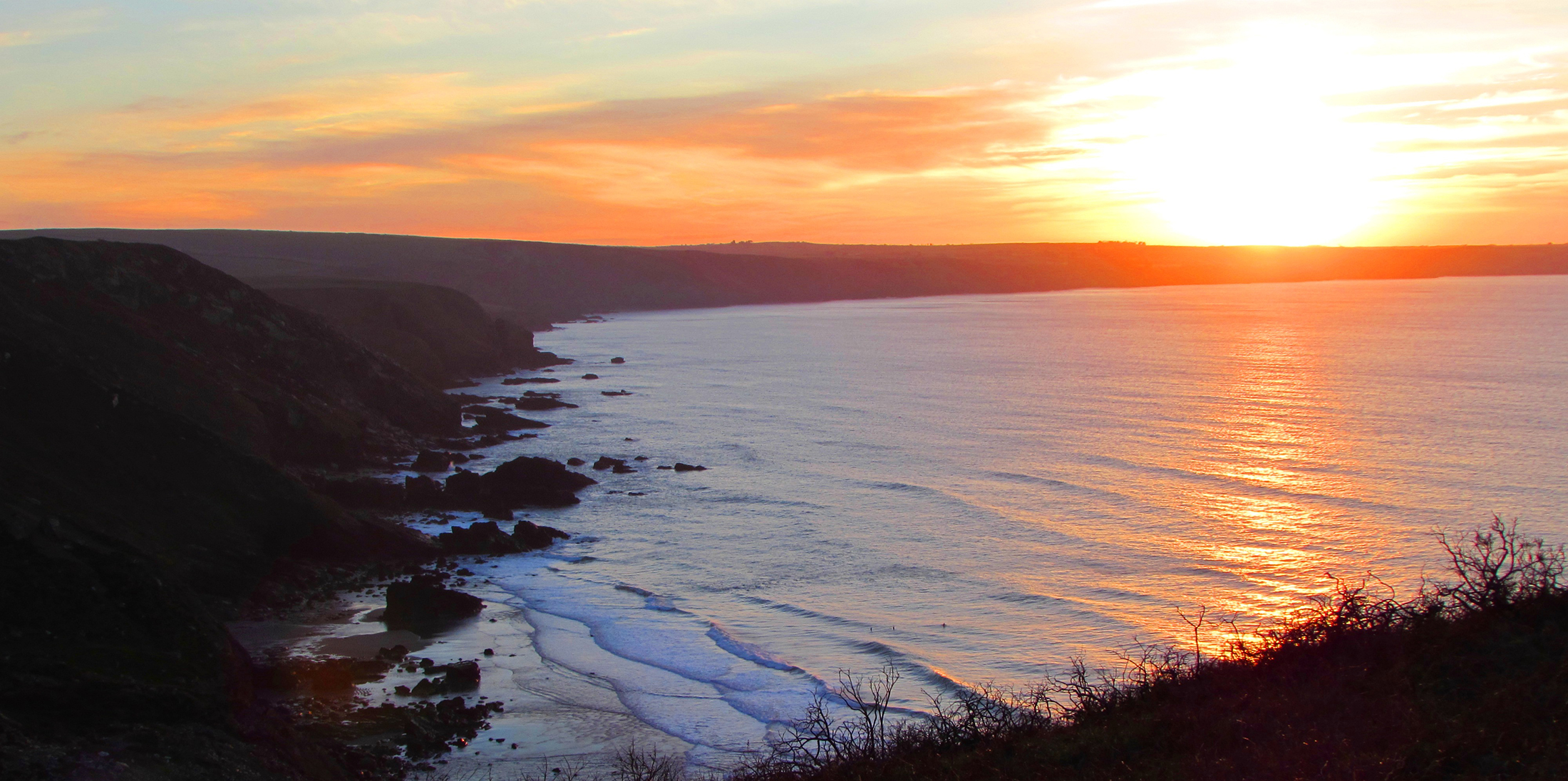 sunset over sea cornwall