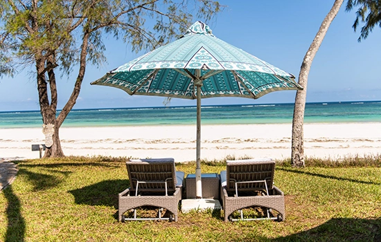 two-sun-beds-parasol-beach