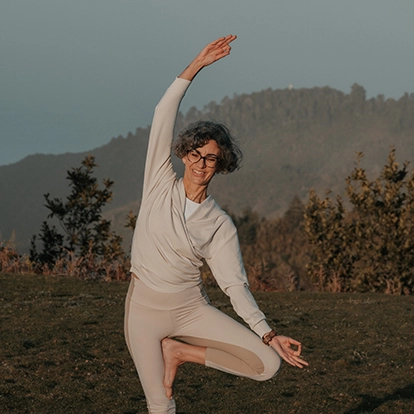 melanie louise doing yoga pose with nature as background